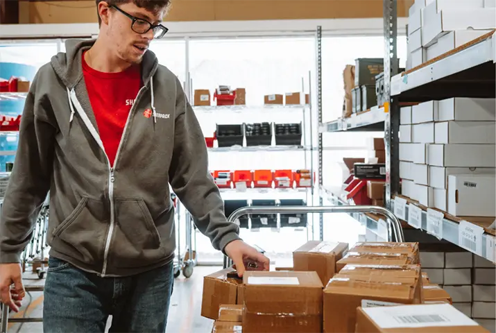 sherpack employee overseeing amazon fulfillment in warehouse