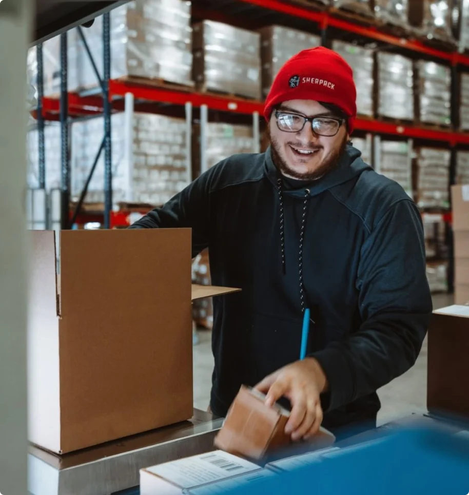 specialist pulling boxes out of bigger box