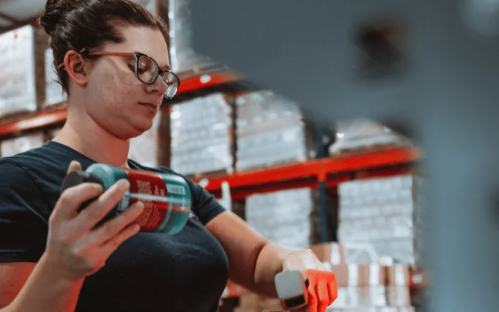 close-up of woman specialist scanning products