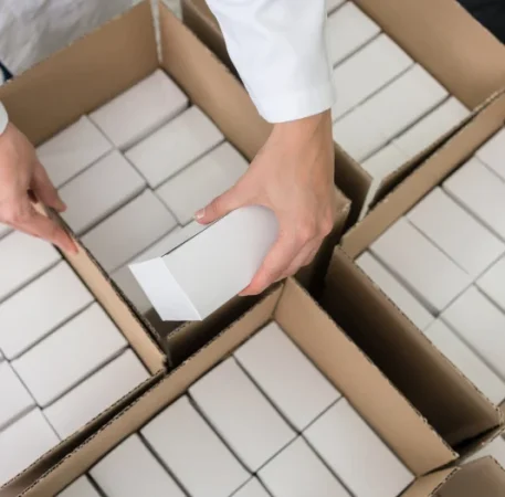 close-up of puttting subscription boxes in box