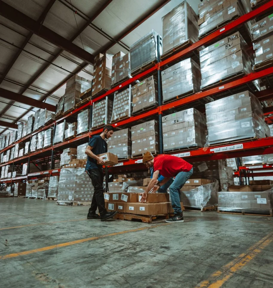 gentleman grabbing subscription boxes in warehouse