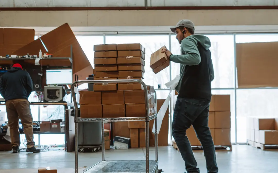gentleman putting boxes on cart