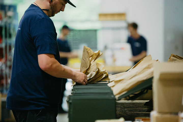 gentleman putting bags in box