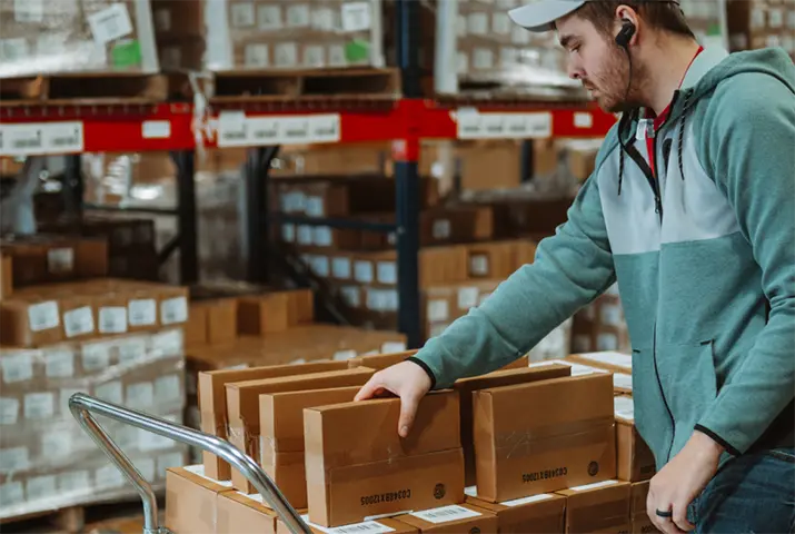 close-up of gentleman grabbing subscription boxes