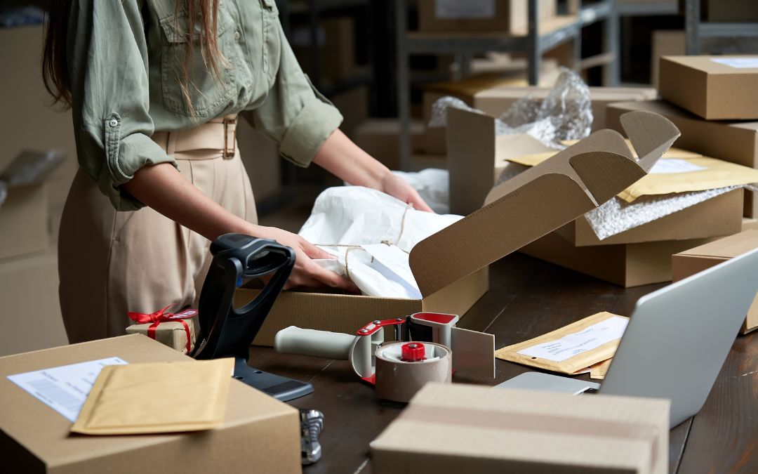 packaging employee kits items together in box