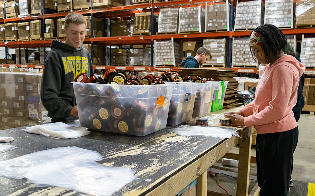 employees packing men's grooming products