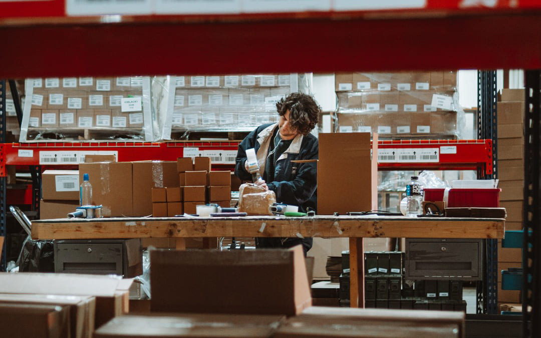 a 3PL employee assembling boxes