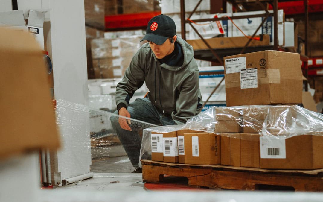 a fulfillment employee packaging boxes