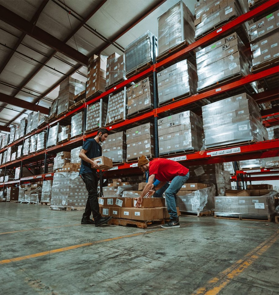 warehouse employees lifting packages