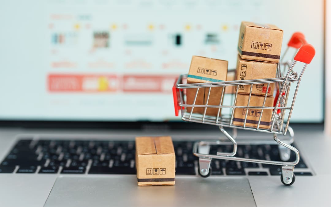 e-commerce shopping concept with a shopping cart on a laptop